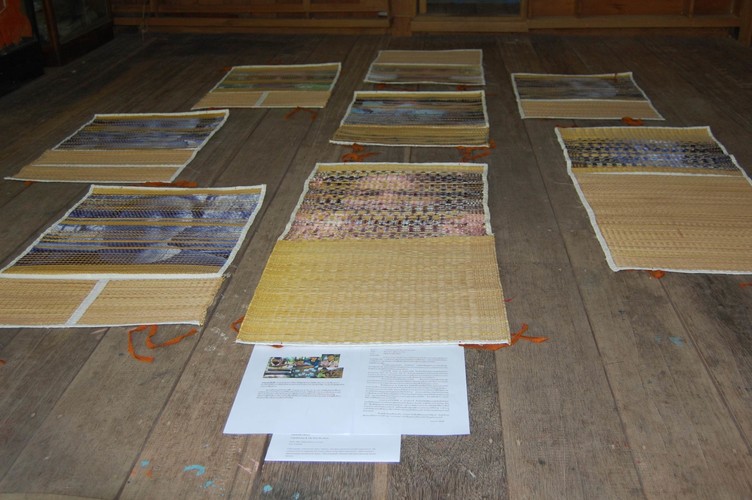 woven mats sitting on a wooden floor
