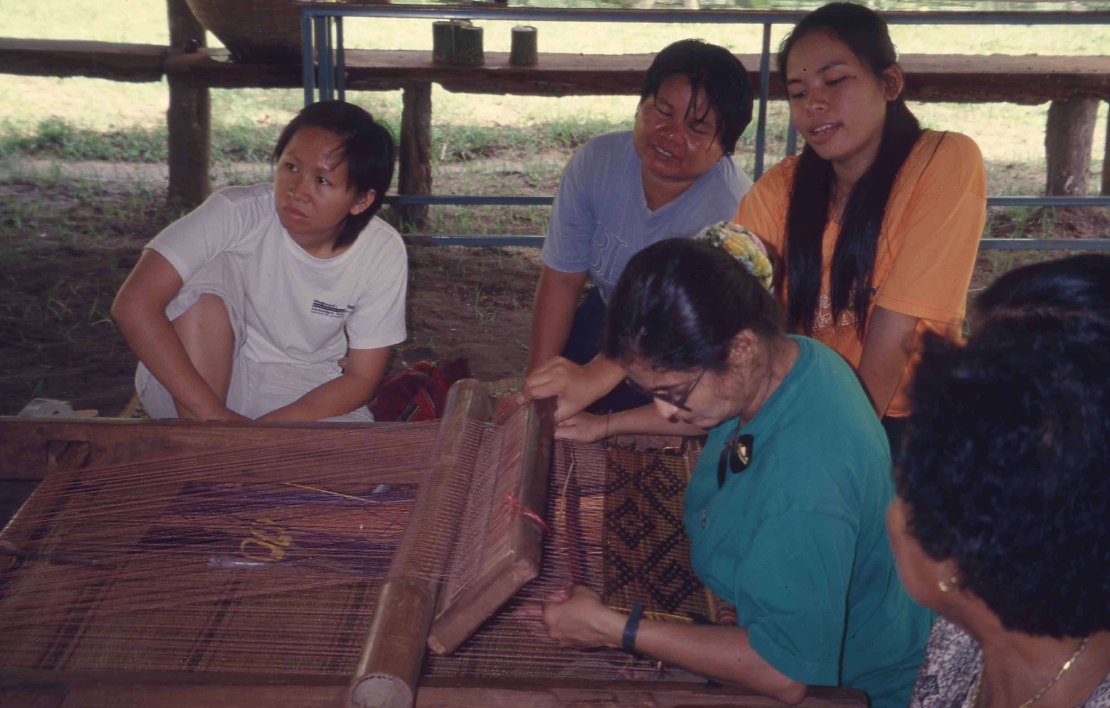 women weaving together at 2001 workshop