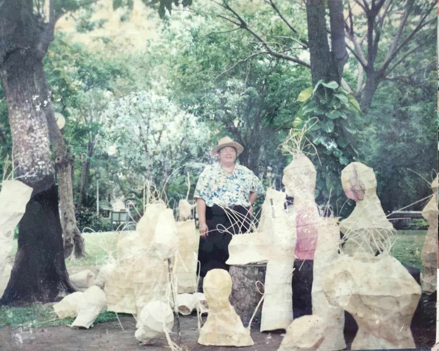 Woman standing amongst artworks