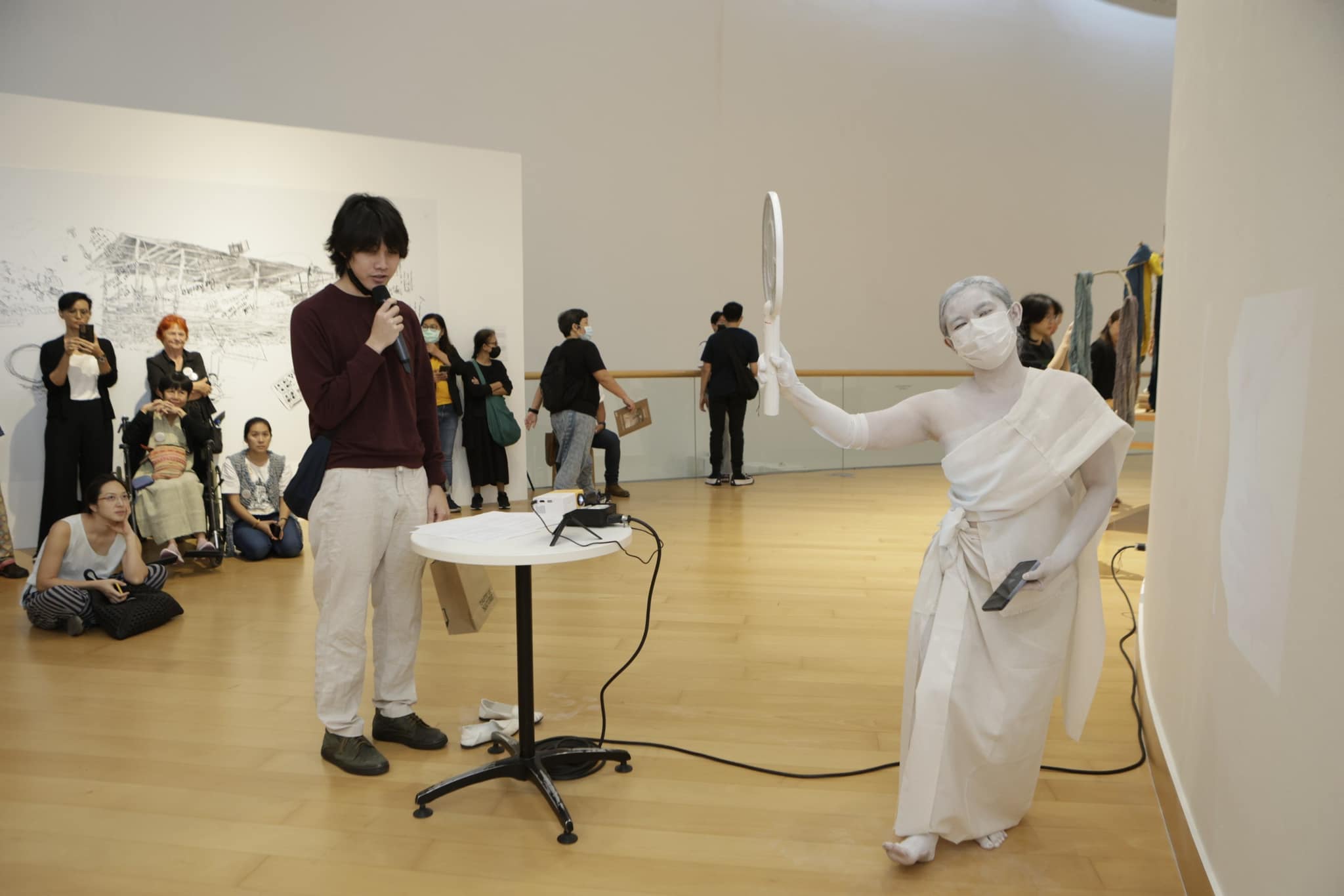 woman in white performing