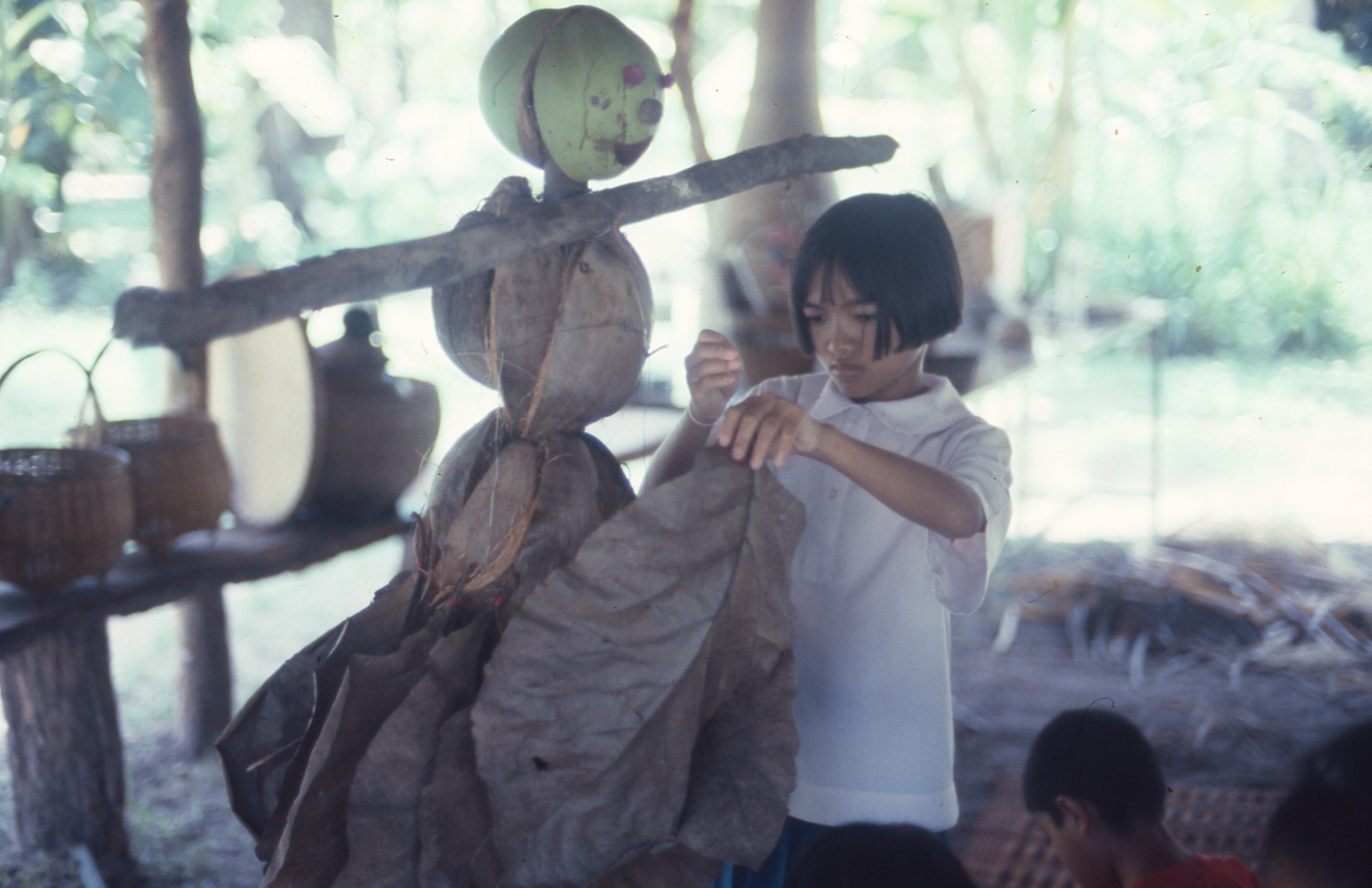 Scarecrow making using natural material found from the land, workshop with school students, by Nitaya Ueareeworakul